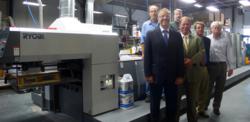 Braintree Printing press operators Michael Foley and Kevin Jenkins (top row) stand in front of the new Ryobi 755XLW with Joseph Yotts, Citizens Bank; Craig Simpson, Lindenmyer; Edward Canzano, Sappi; and Jim Corliss, Braintree Printing owner.